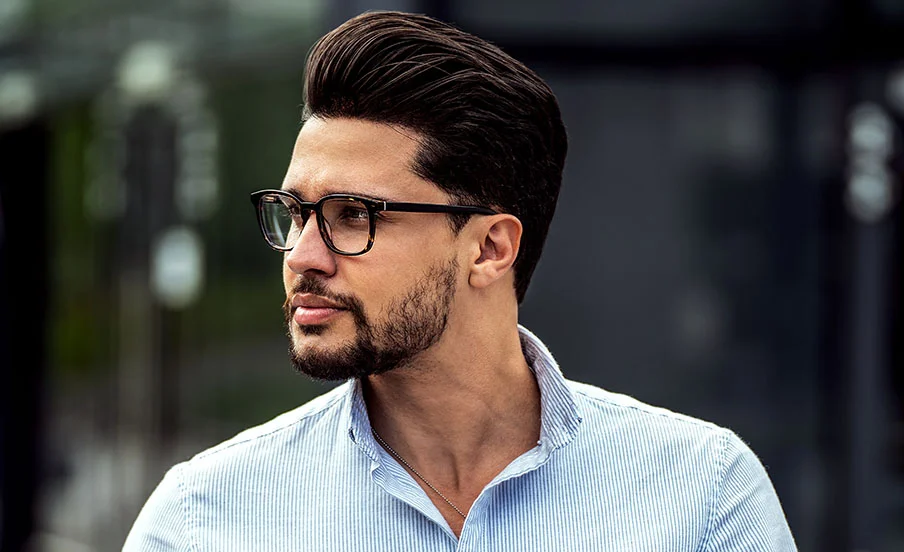 Man wearing glasses with a chiseled face